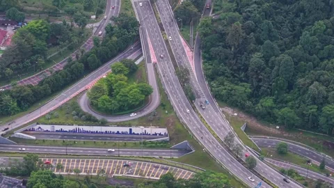 Modern highway interchange surrounded by lush tropical forest. Stock Footage 341415076