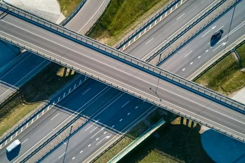 Modern highway interchange system with multiple lanes and moving vehicles seen Stock Photos