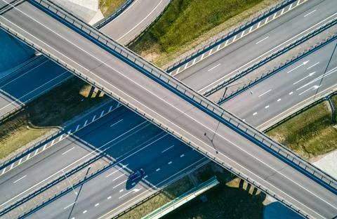Modern highway interchange system with multiple lanes and moving vehicles seen Stock Photos