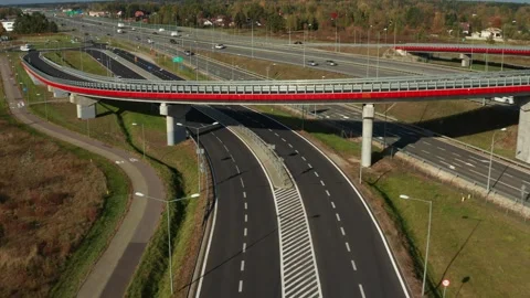 Modern highway multilevel junction with bridges and overpasses Stock Footage 256107352
