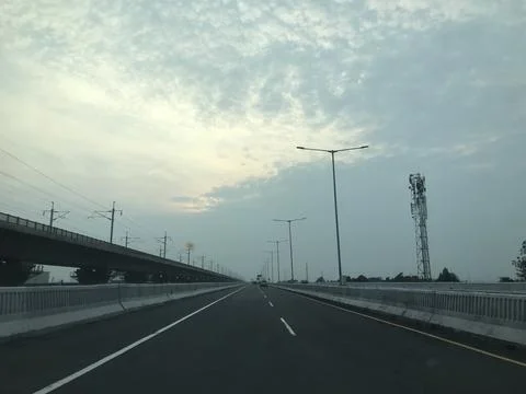 Modern Highway Toll Road with Elevated Rail Line and Telecom Tower Stock Photos