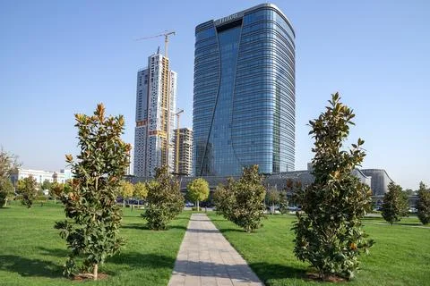 Modern Hilton hotel on the background of a complex under construction. Tashkent Stock Photos