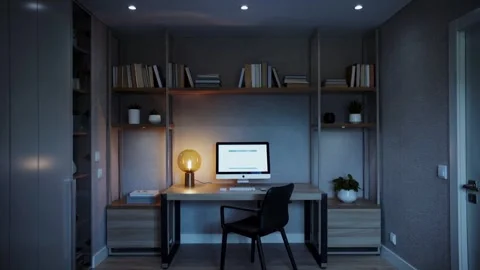 Modern home office with a computer, desk lamp, and bookshelves, showcasing a 스톡 동영상 335786239