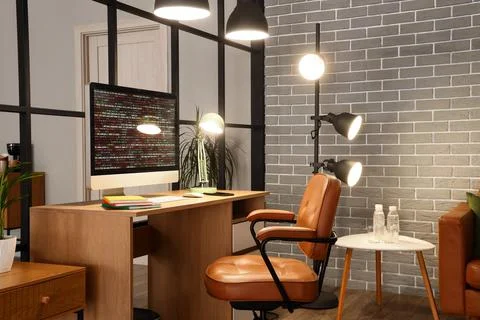 Modern home office with computer displaying code Stock-Fotos
