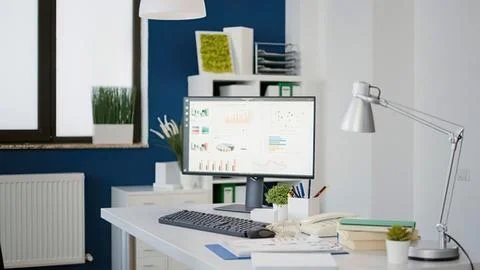 Modern home office workspace with computer setup Stock Photos