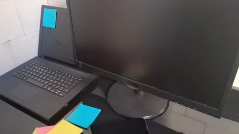 Modern home office workspace featuring laptop monitor and colorful sticky notes Stock Footage 340038080