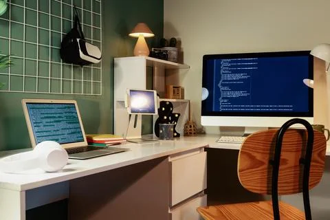 Modern home office workspace with multiple screens and coding Fotos Stock