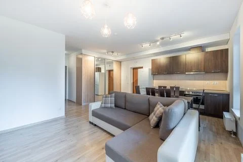 Modern Home Open Plan Kitchen and Living Room Interior with Dining Table an.. Stock Photos