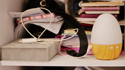 Modern Home Workspace Shelf With Smart Lamp Headphones And Creative Clutter Stock Footage 327533796