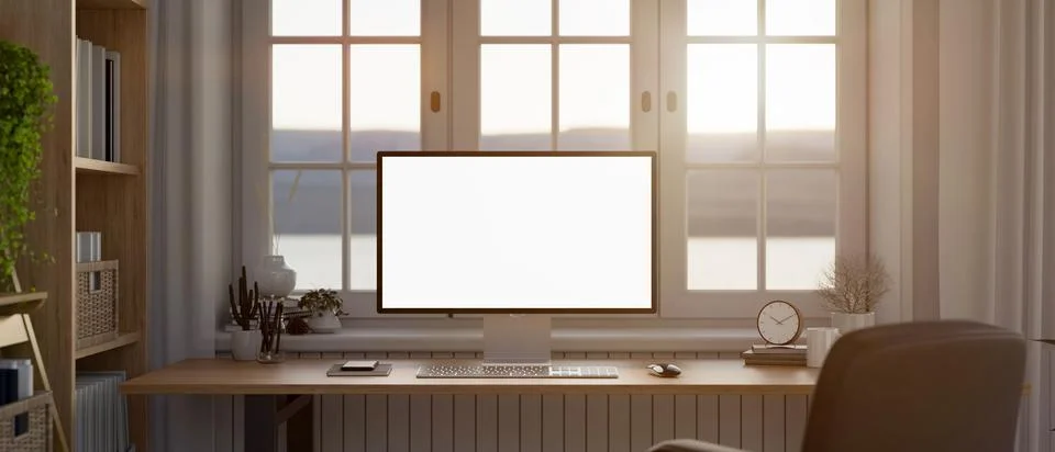 Modern home workstation, a PC computer white screen mockup on a wooden desk.. イラスト素材