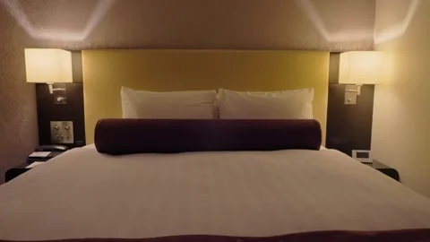 Modern hotel bedroom interior with comfortable bed Stock Footage 340921032