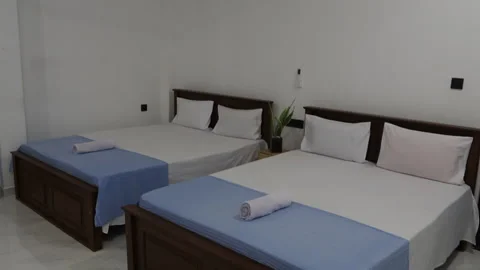 Modern hotel bedroom interior with two beds Stock Footage 340642502