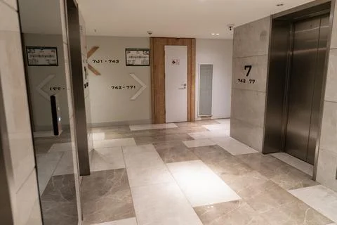 Modern hotel elevator lobby with marble floor Stock Photos
