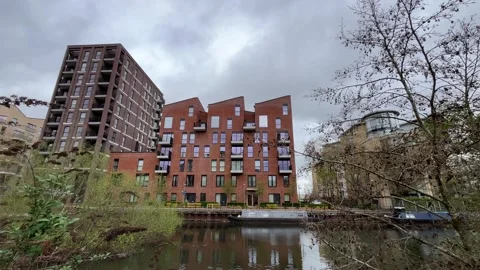 Modern housing development in the UK by the river Stock-Footage 332069745