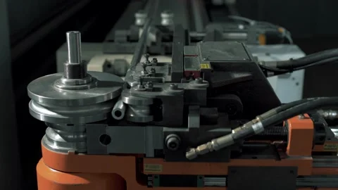 Modern, huge orange numerically controlled machine bends metal structures Stockbeeldmateriaal 179703673