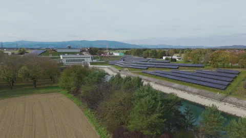 Modern hydro power facility with integrated solar panel systems from aerial view Stock Footage 327730769