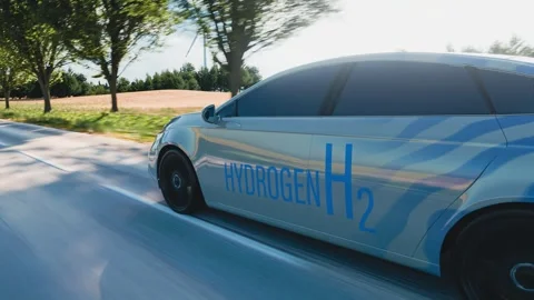 A modern hydrogen-powered car in motion, driving on a scenic road. A perfec.. Stock Footage 290954964