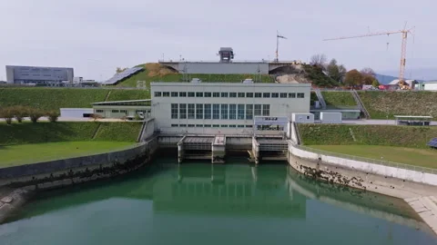 Modern hydropower plant with integrated solar panel installations Stock Footage 327865963