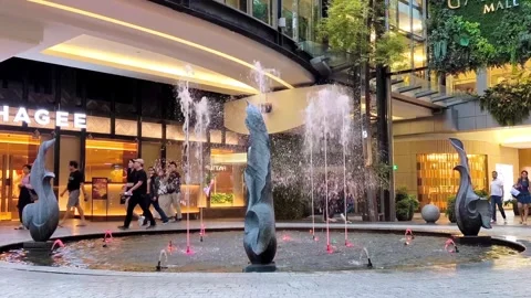 Modern illuminated fountain with sculptural elements Video stock 343673347
