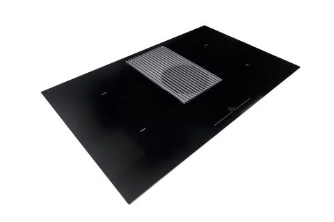 Modern induction cooktop features black glass ceramic surface with integrated Stock Photos