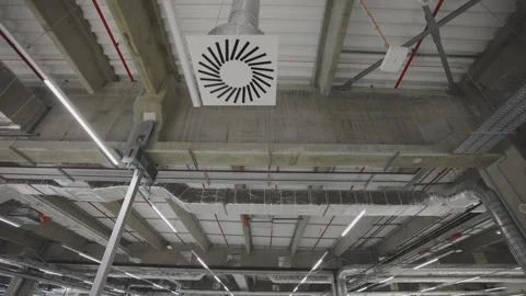 Modern industrial ceiling with exposed ventilation and lighting system movi.. Stock Footage 337530610