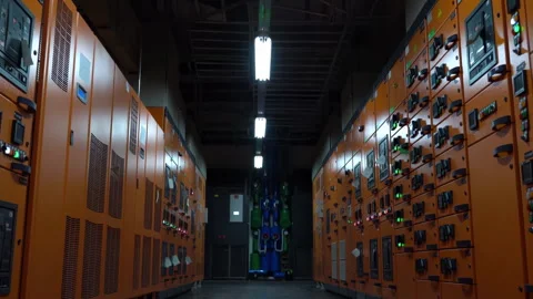 Modern Industrial Data Center with Rows of Yellow Server Cabinets Control Room Stock Footage 309106950