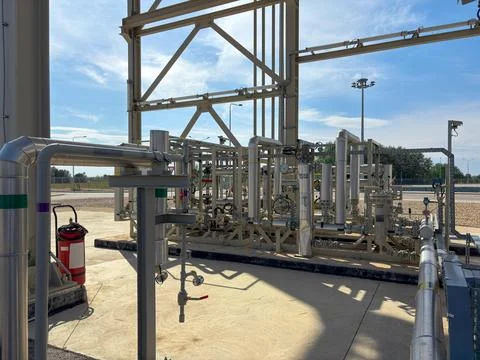 Modern industrial gas processing installation with metal pipelines Stock Photos