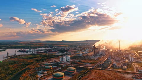 Modern industrial plant in the light of setting sun. Tanks and pipelines in the Stock Footage 340128547