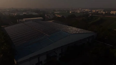 A Modern Industrial Warehouse Complex Equipped with Rooftop Solar Panel Array Stock Footage 334194269