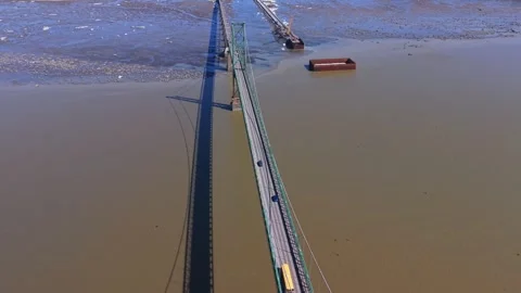 Modern infrastructure bridge spanning wide river landscape Stock Footage 333216600