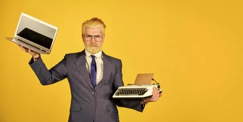 Modern instead outdated. Connoisseur of vintage values. Typewriter against Foto stock
