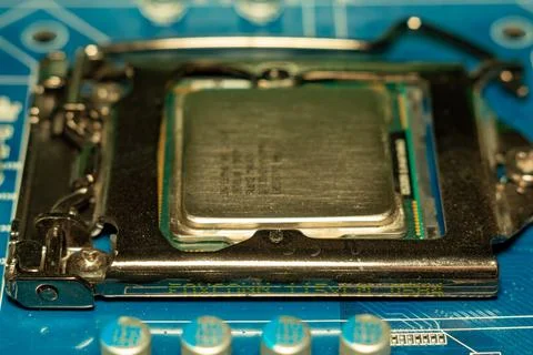 Modern intel processor installed on motherboard with blue circuitry technology Stockfoto's