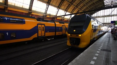 Modern intercity train arriving platform in Amsterdam Central station in Europe. Stock Footage 95049816