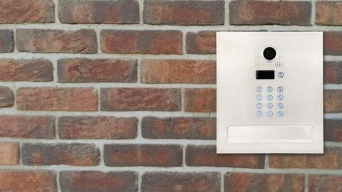 Modern Intercom Panel on Brick Wall Foto stock