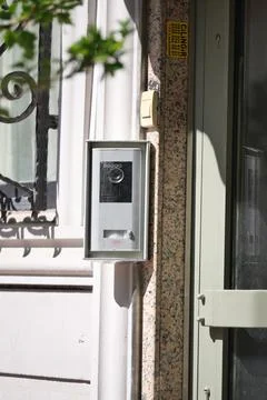 Modern intercom system attached to a building entrance Stock Photos