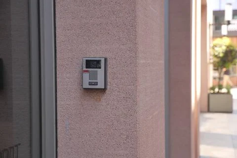 Modern intercom system installed on a smooth concrete wall Foto stock