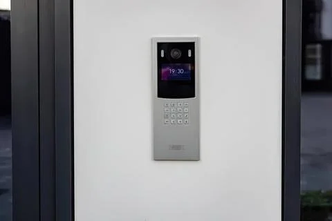 Modern intercom system mounted on a wall in a building Stock Photos