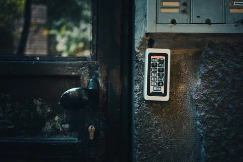 A modern intercom on the wall of an old building Stock Photos