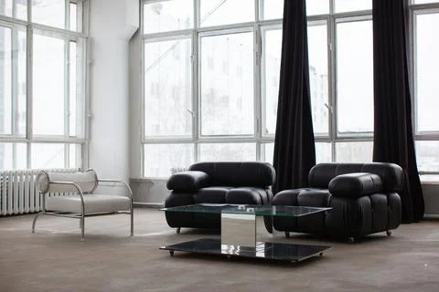 Modern interior with black sofa. Stock Photos