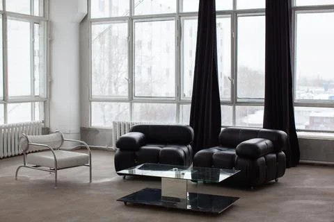 Modern interior with black sofa. Stock Photos