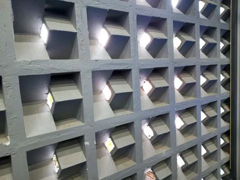 Modern Interior Breeze Block Wall With Geometric Concrete Pattern And Natur.. Stock Photos