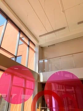 Modern interior decor featuring large circular pink elements and expansive Stock Photos