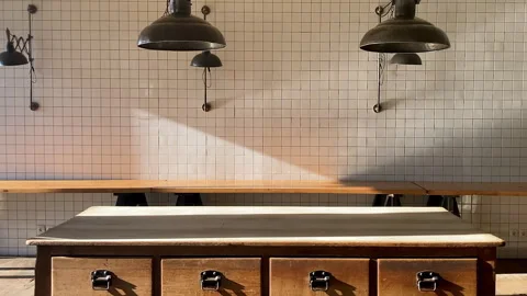 Modern interior design and decor with wooden table cabinet and white tile wall Stock Footage 251891701