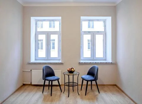 Modern interior design concept. Minimalistic style. Two blue armchairs and a Stock Photos