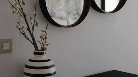 Modern interior design features three round mirrors suspended on a white wa.. Stock Footage 291537610