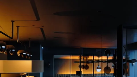 Modern interior design with unique lighting fixtures in a restaurant Stock Footage 344851696