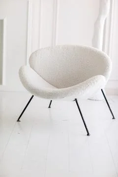 Modern interior design with white boucle fabric armchair and black metallic legs Stock Photos