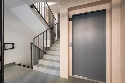Modern Interior with Elevator and Staircase Stock Photos