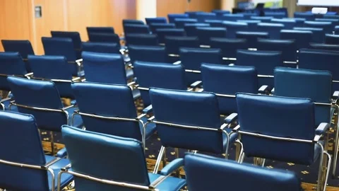 Modern interior empty conference hall blue seats neat rows chairs vacant place Stock Footage 82362790