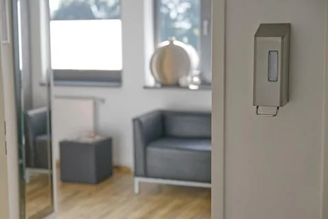 A modern interior featuring a sleek door handle, a stylish black leather co.. Stock Photos